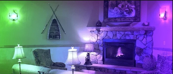 ILC RGB LED bulbs lighting a living room in purple